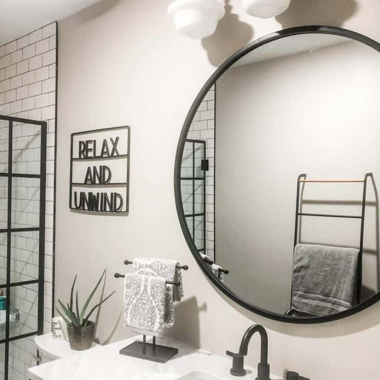 Matte Black Round Mirror in Basement Bathroom
