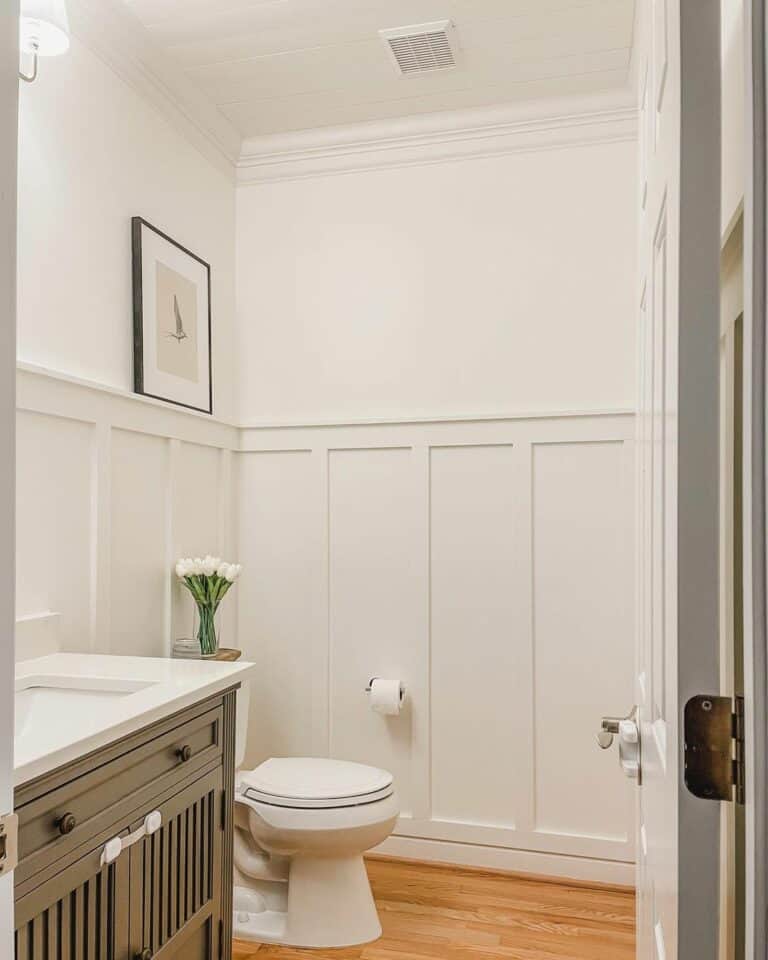 Minimalist Neutral Small Bathroom With Wainscoting