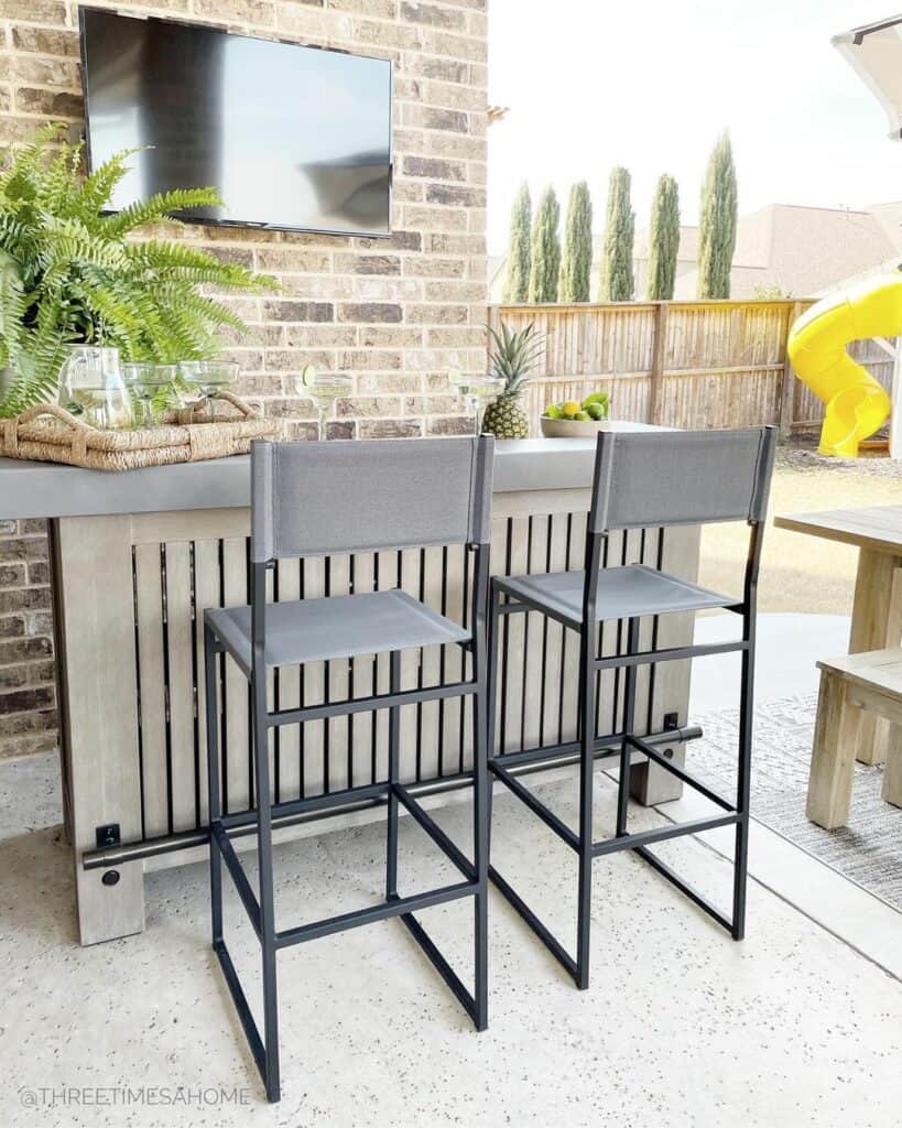 Modern Concrete Patio Ideas With Brick Wall - Soul & Lane