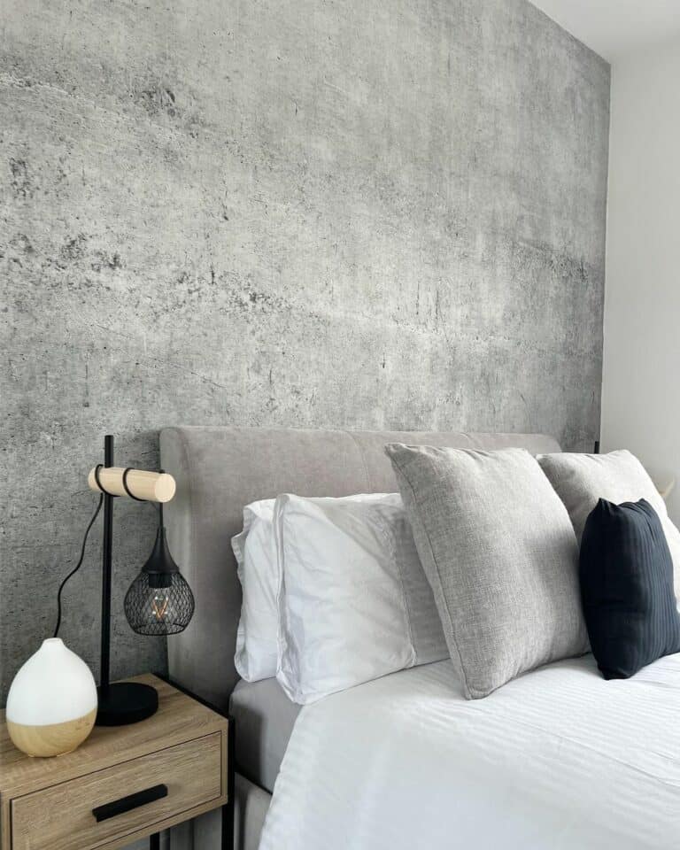 Modern Guest Bedroom With Striking Concrete Accent Wall