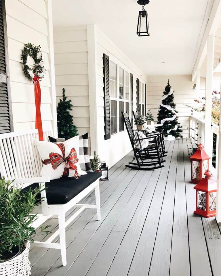 Monochromatic Farmhouse-inspired Porch With Red Christmas Lanterns