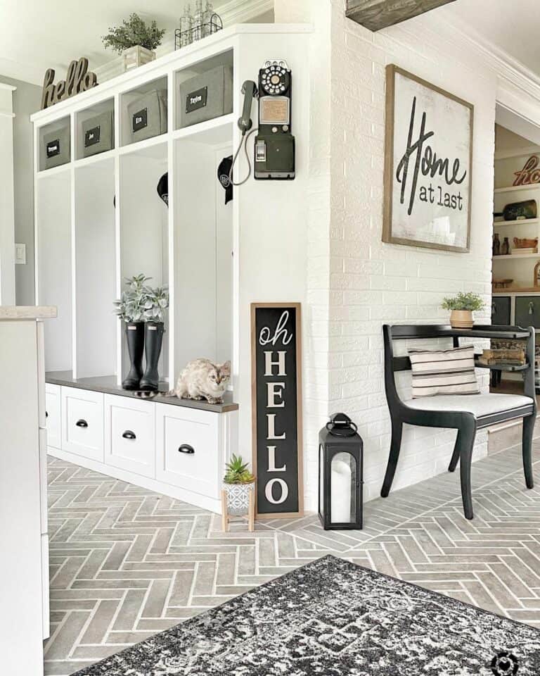 Monochromatic Mud Room With Gray Herringbone Tile Floor