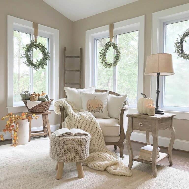 Neutral Autumn Living Room With Wreaths for Windows