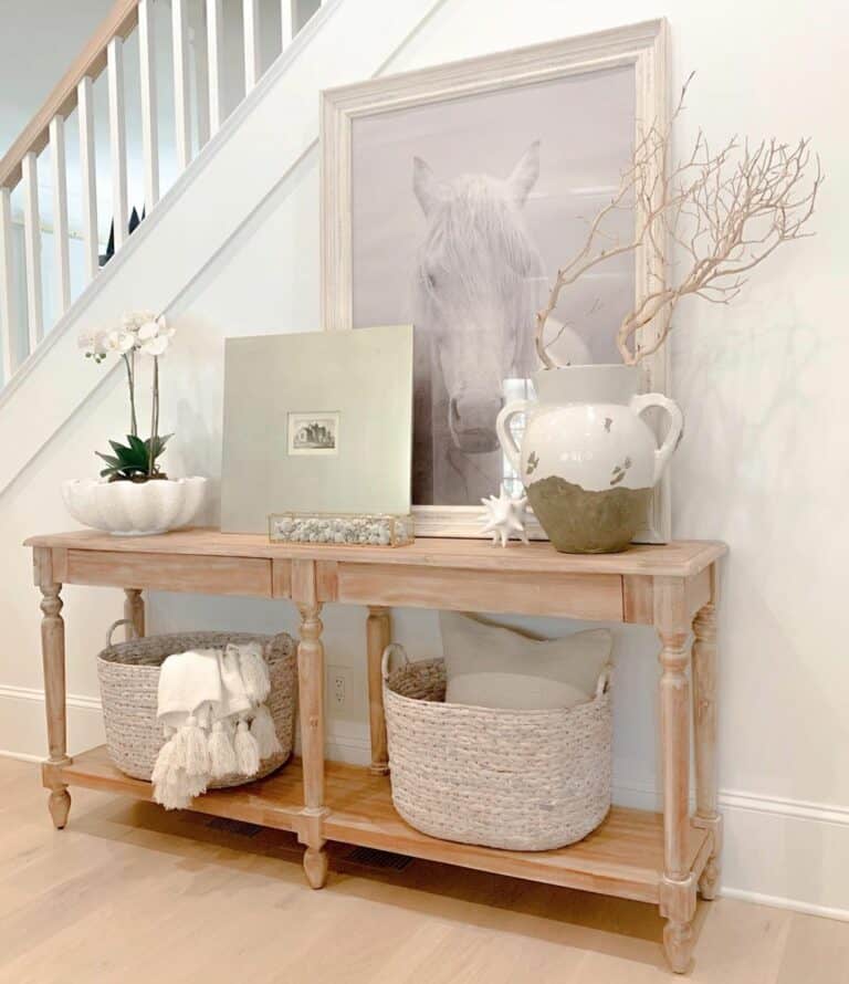 Neutral Entryway Scene With Wooden Console Table