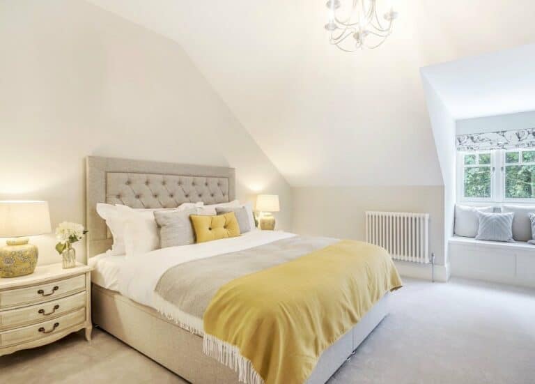 ]Neutral Upholstered Headboard Against a White Wall