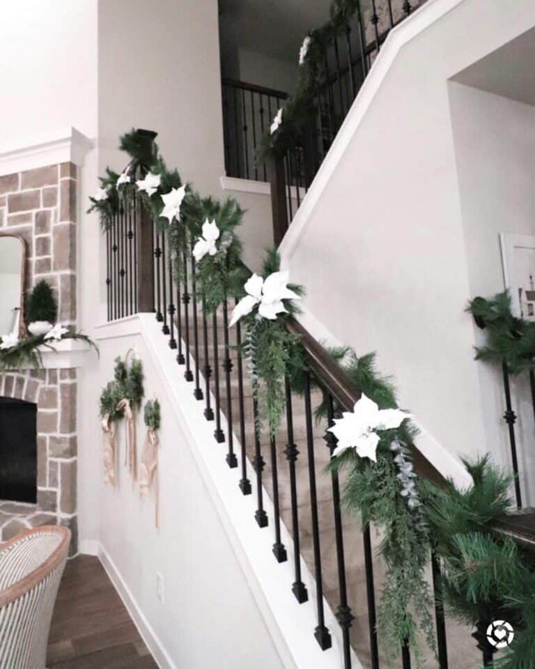 Oak-colored Staircase With White Christmas Flowers