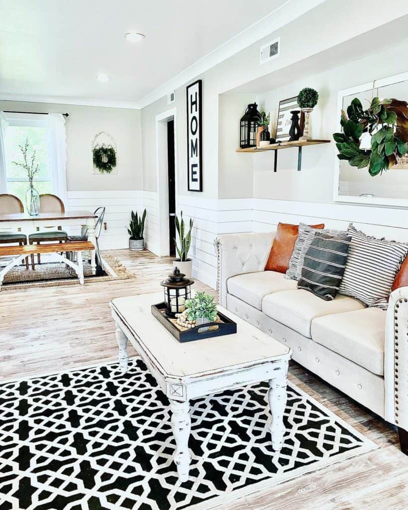 Open Great Room With Black and White Area Rug
