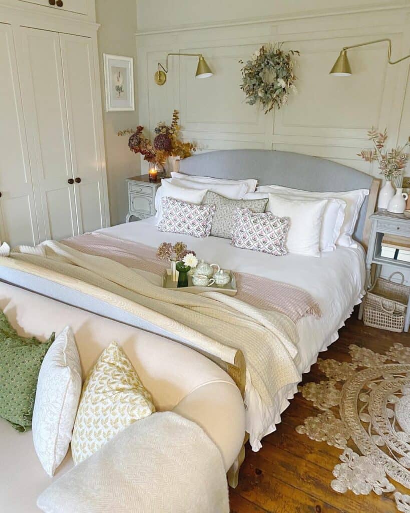 Pastel Bedding and Gold Sconce Lamps
