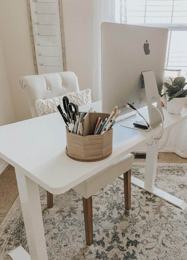 Patterned Rug Beneath White Chair and Desk