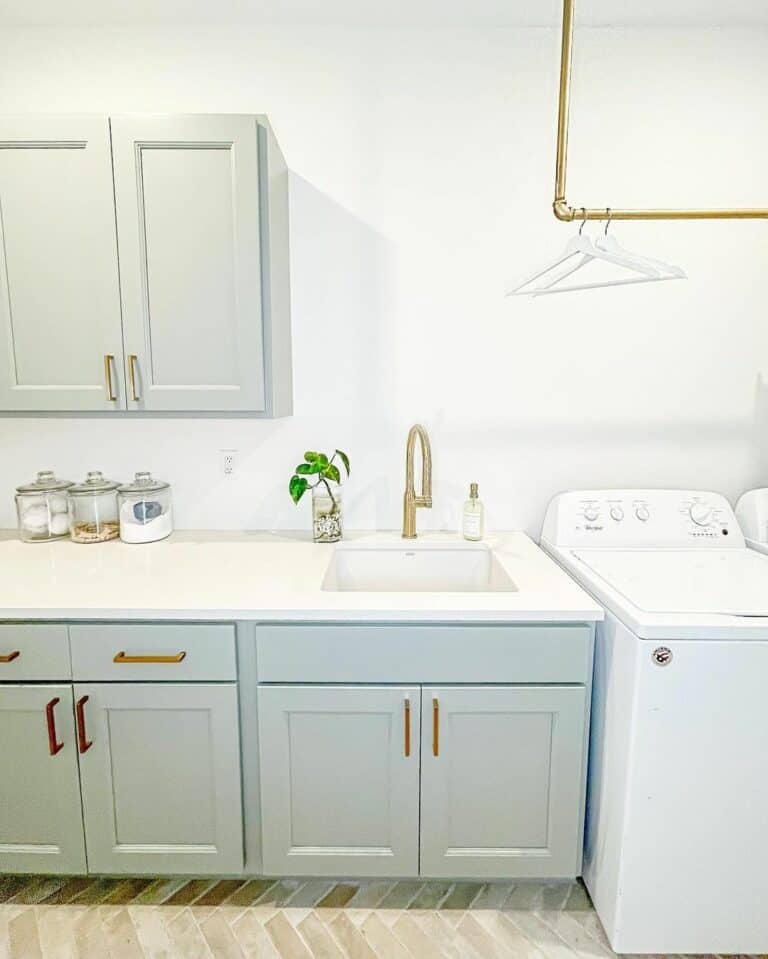 Pristine White Laundry Room With a Brown Tile Floor