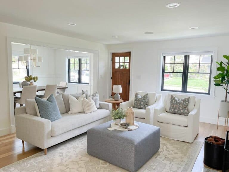 Recessed Lights and a Gray Ottoman