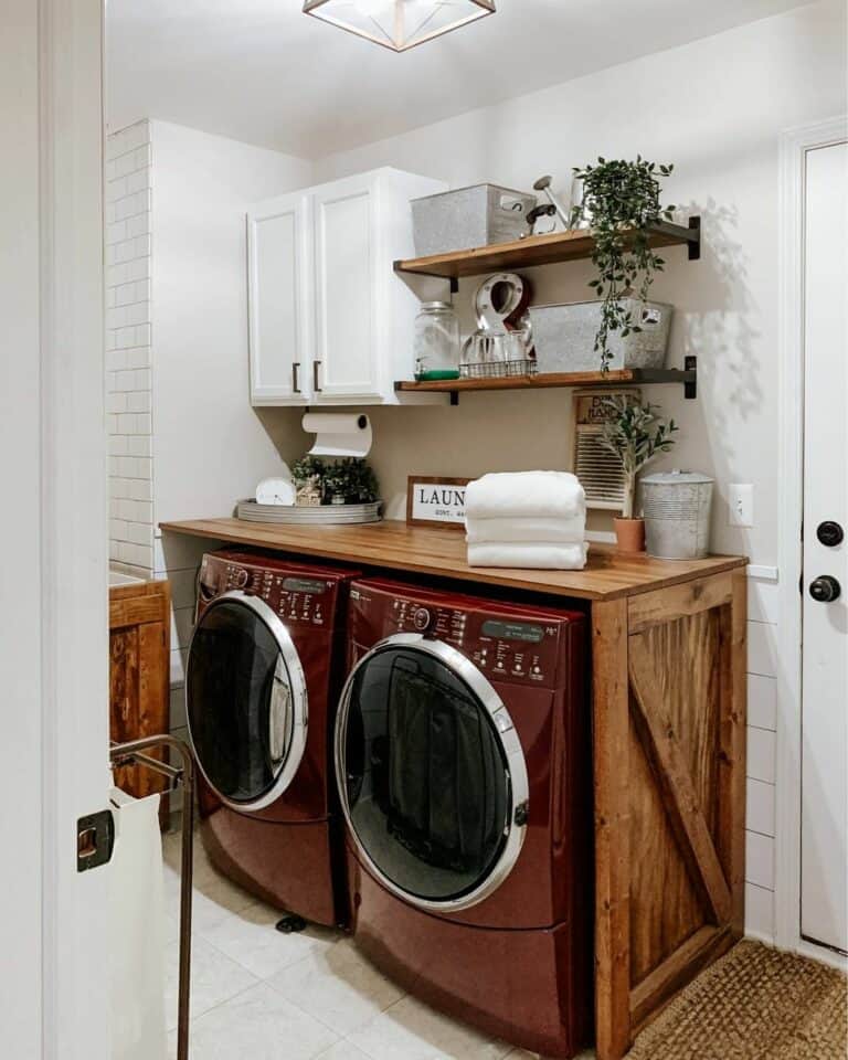 Red Washer and Dryer Under a Butcher Block Countertop