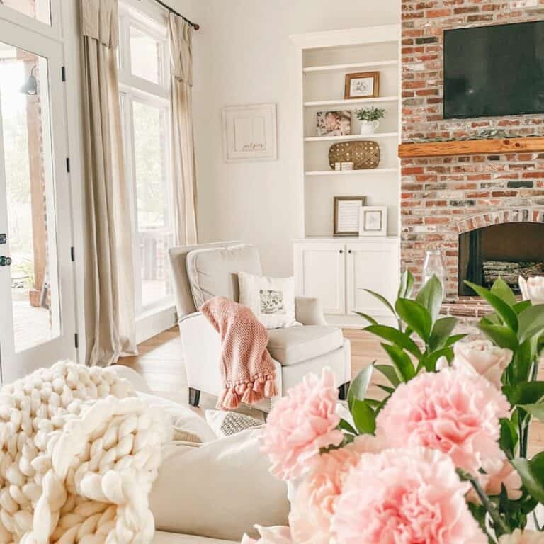 Refreshing Farmhouse Living Room With Cheery Pink Accents