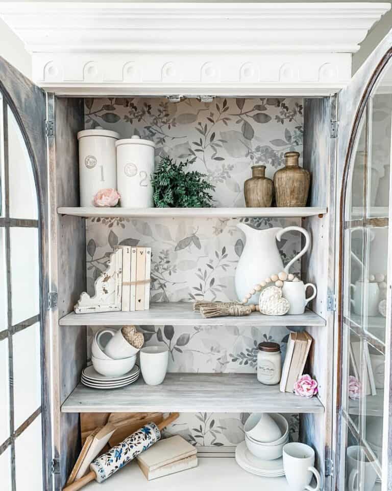 Repurposed China Cabinet With Plant-themed Wallpaper