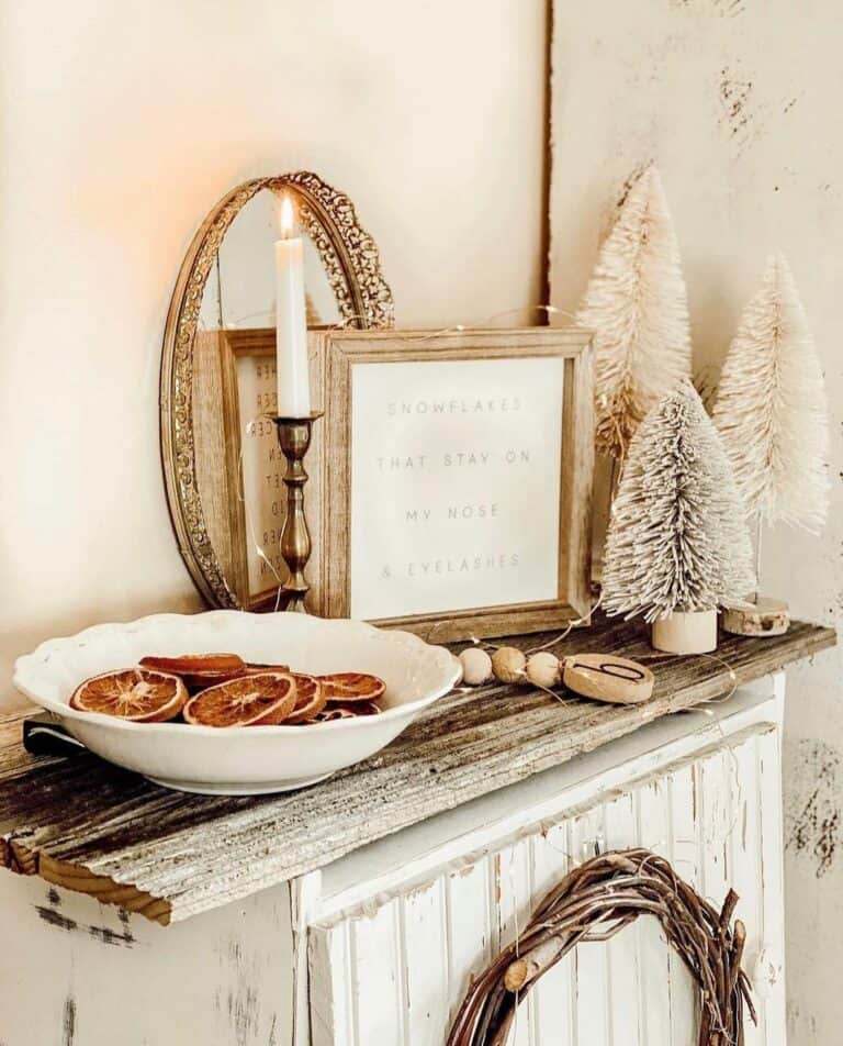 Rustic Console Table With White and Orange Christmas Decorations