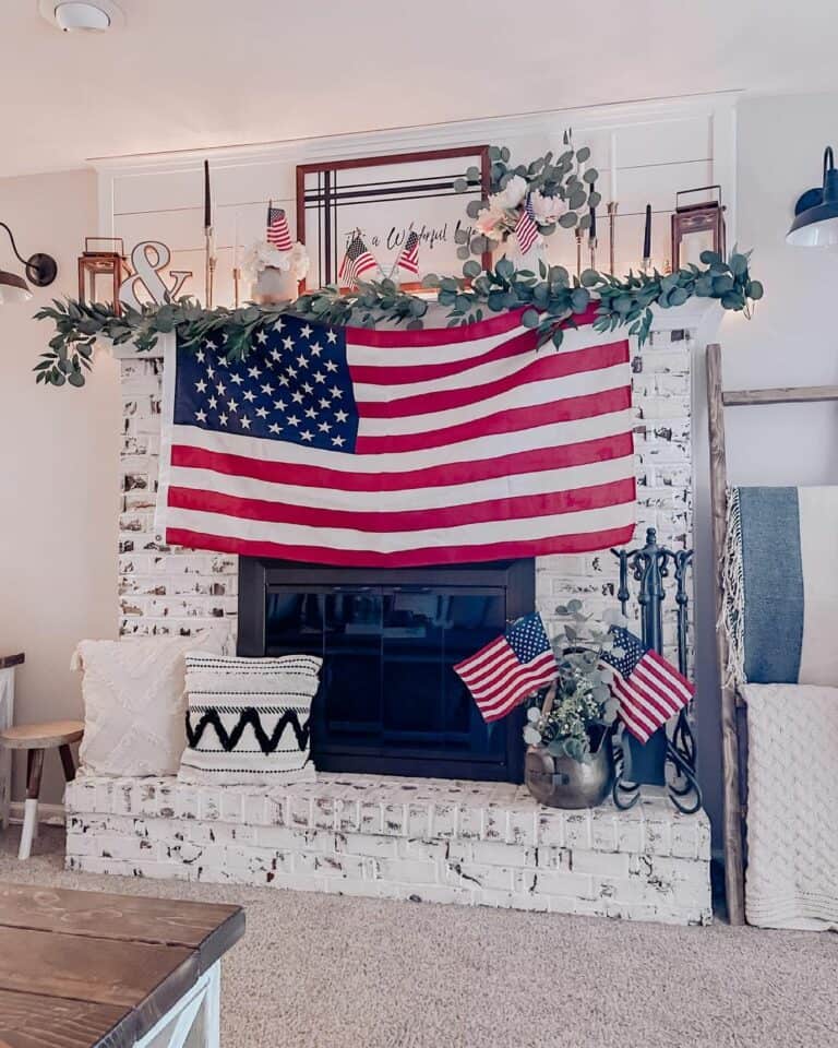 Rustic White Painted Brick Fireplace With American Flag