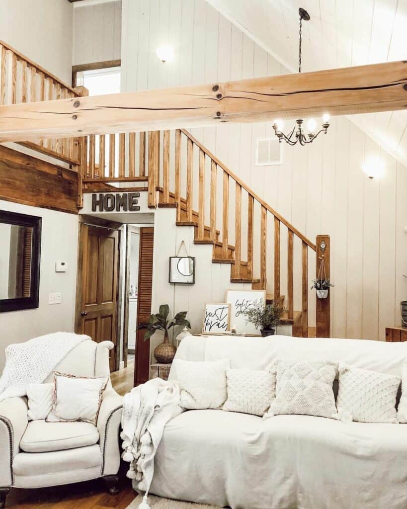 Shiplap Staircase With Large Black Chandelier