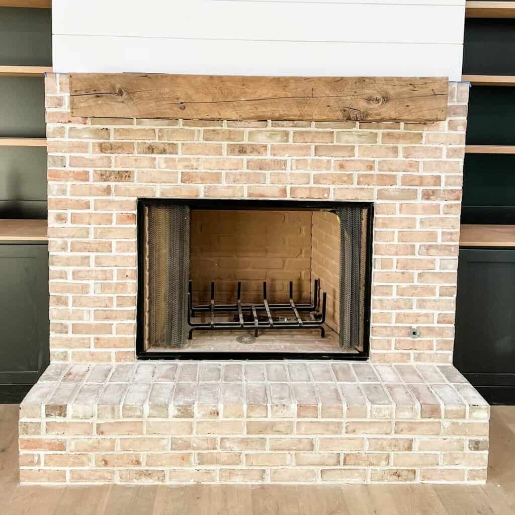Simple Brick Hearth With Large Wooden Mantel