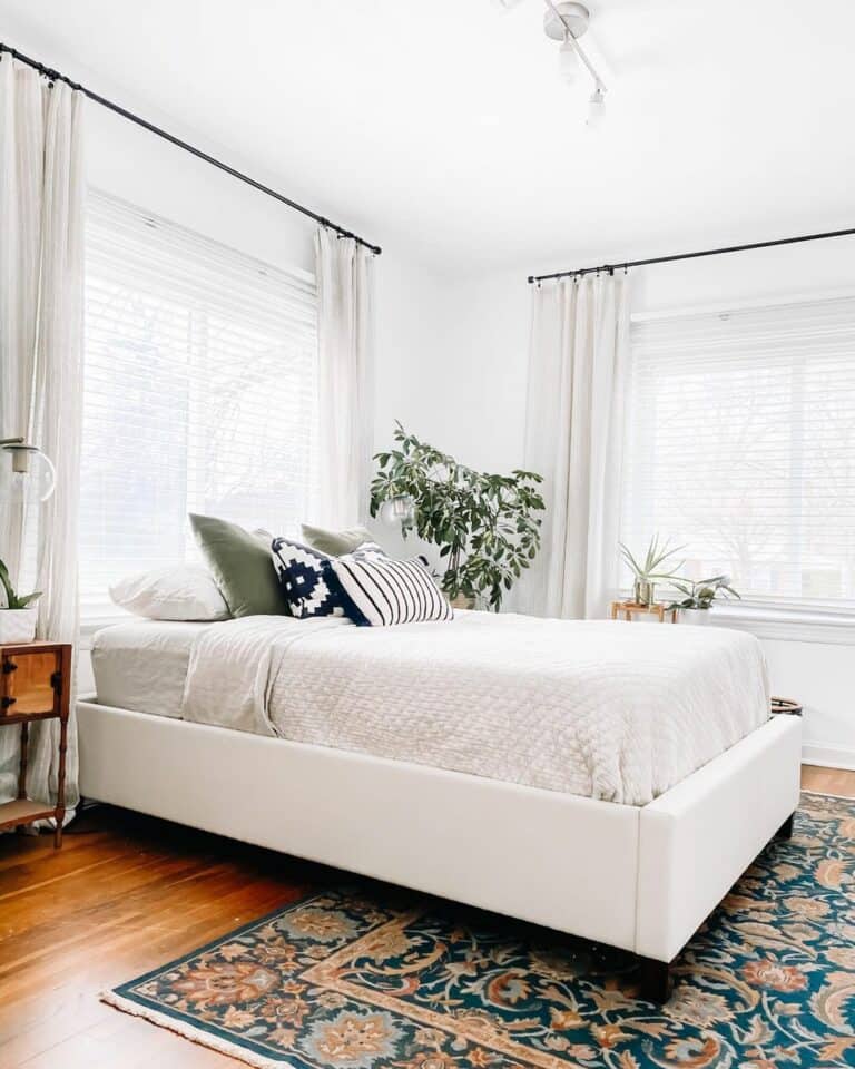 Sleek Modern Guest Bedroom With Bright Accent Rug