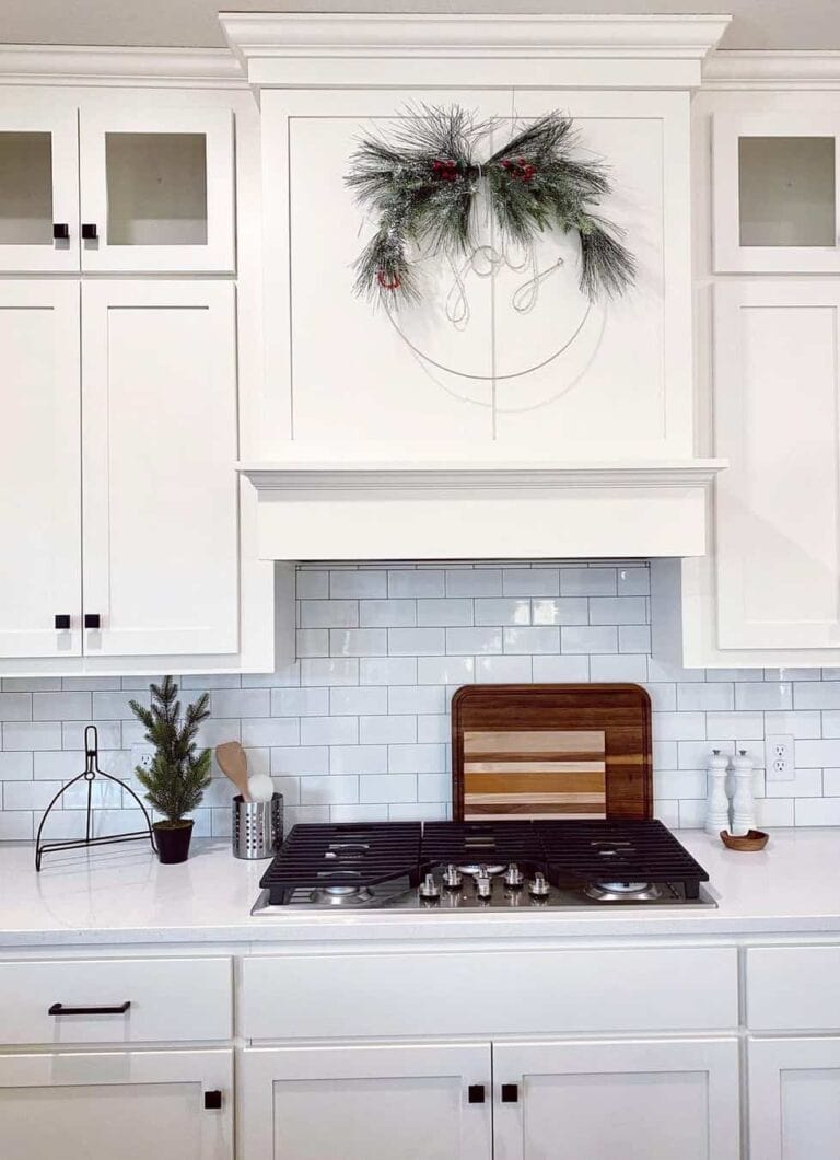 Square Knobs Adorn White Shaker Cabinets