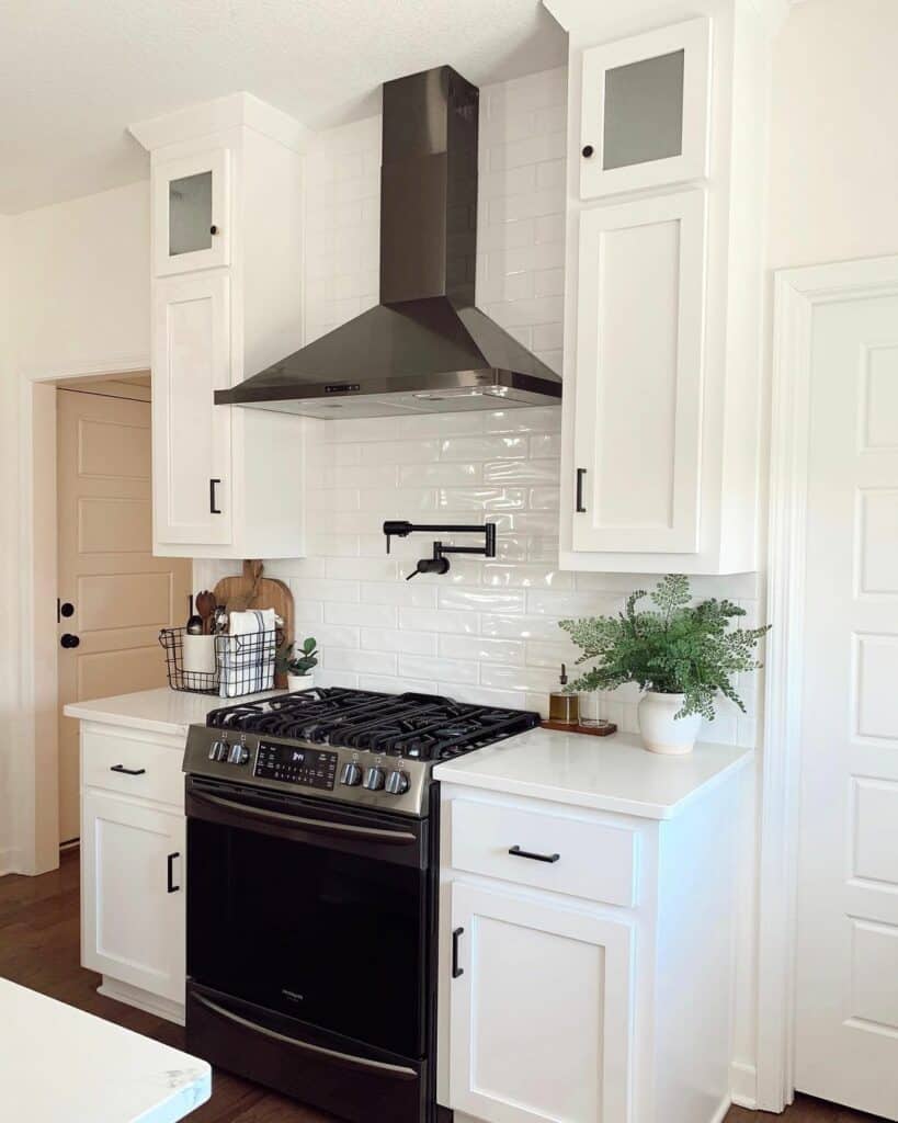 Stainless Steel Appliances in White Kitchen