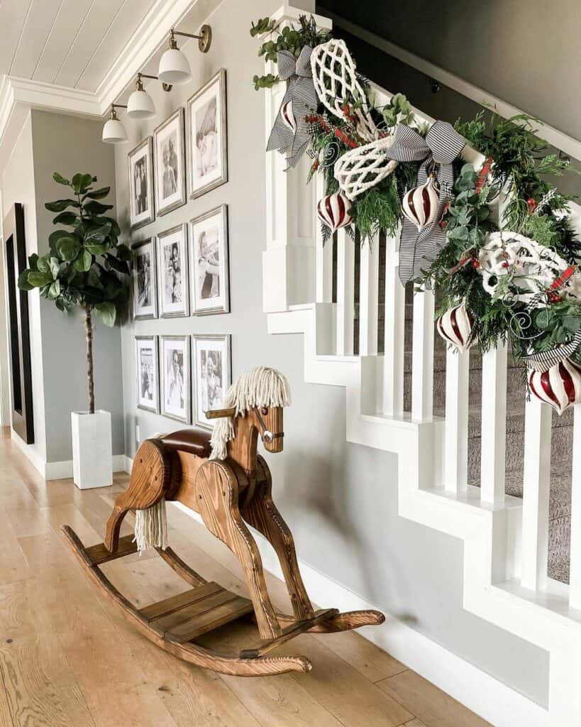 Staircase With Christmas Decorations and Rocking Horse