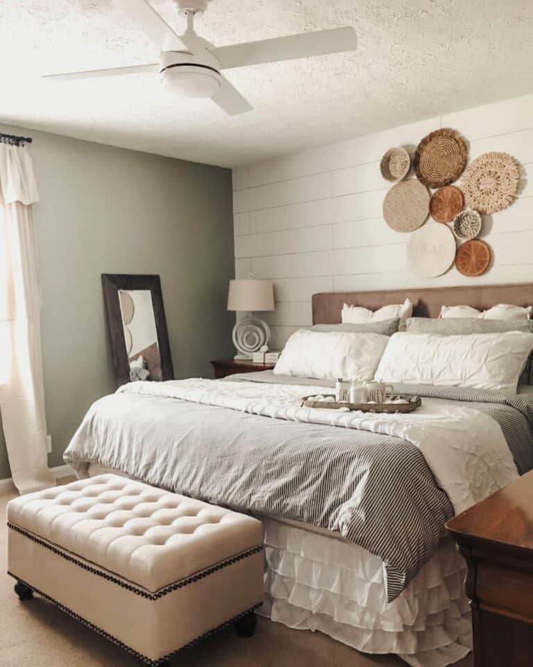Tufted Ottoman Accompanies Gray and White Bedding
