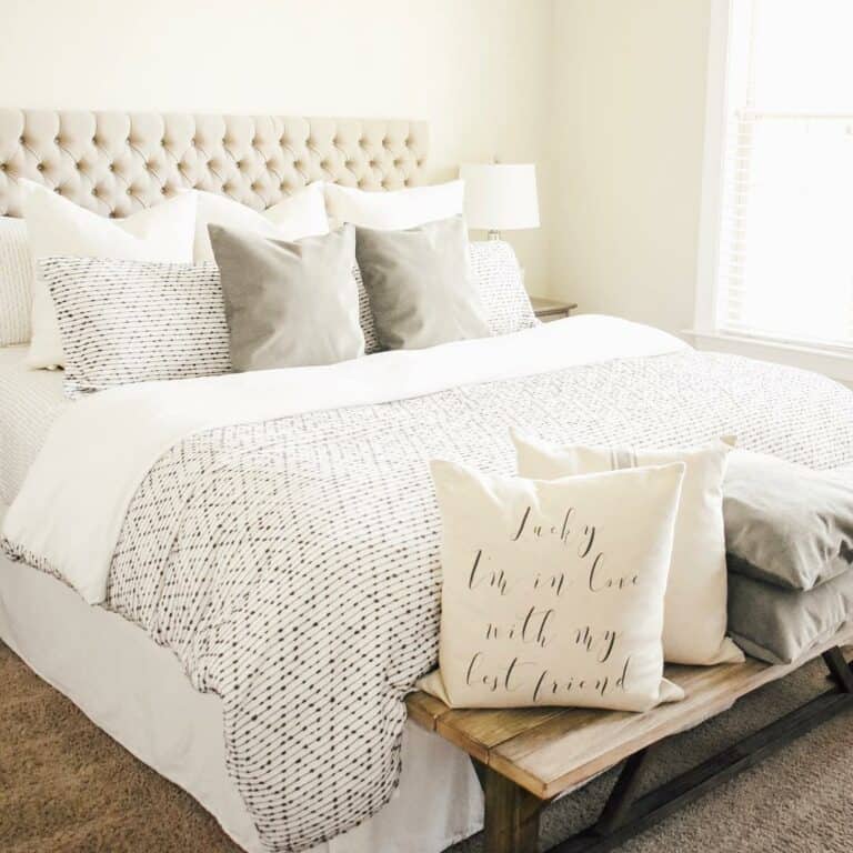 Tufted White Headboard Against a Cream-colored Wall