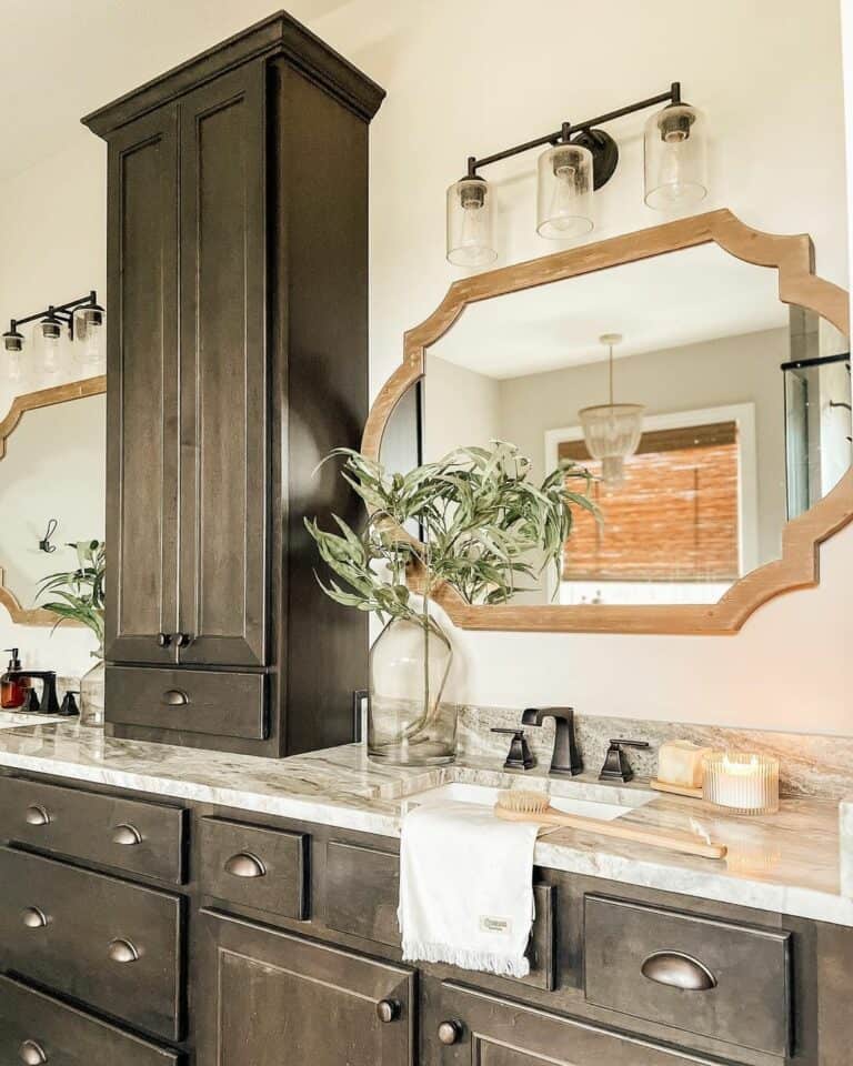 Uniquely Shaped Mirrors Separated by Wood Cabinet