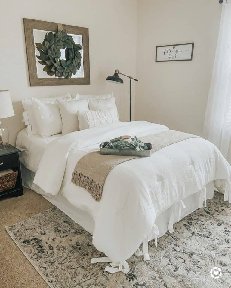 White Bedding and Floor Lamp