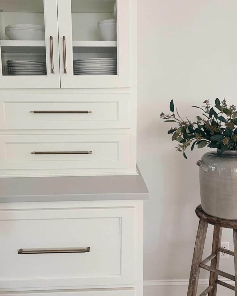 White Cabinets Paired With Gray Quartz Countertops