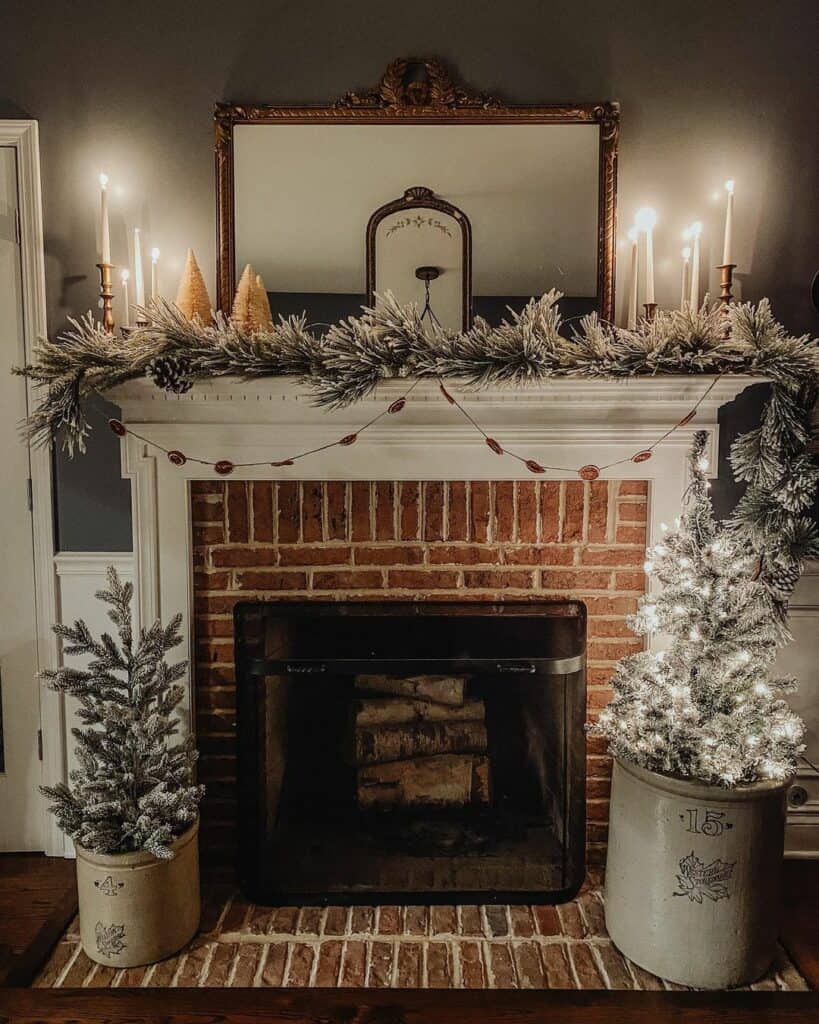 White Candles in Gold Candlesticks on a White Mantel