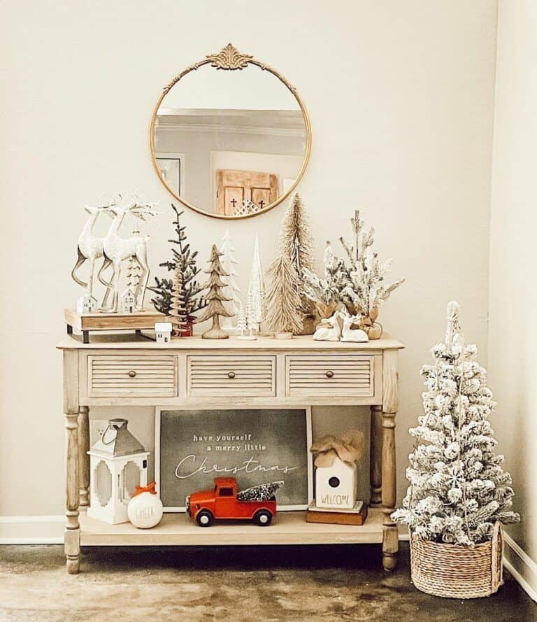 White Christmas Deer Decorations on Wood Console Table
