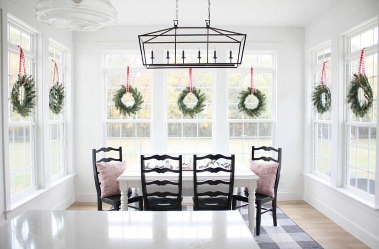 White Christmas Dining Room With Wreaths on Windows