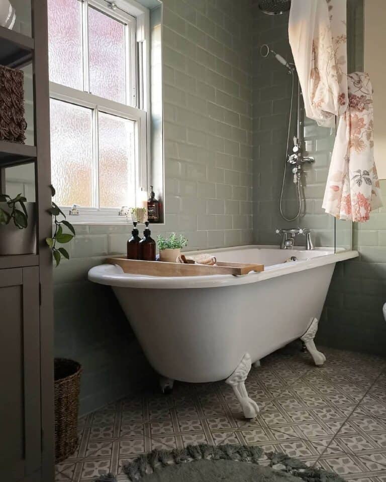 White Clawfoot Tub Surrounded by Gray Subway Tile