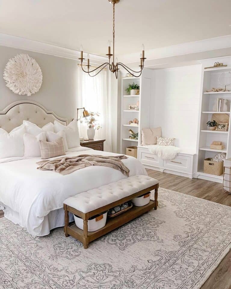 White Decorated Bedroom With a Gold Chandelier