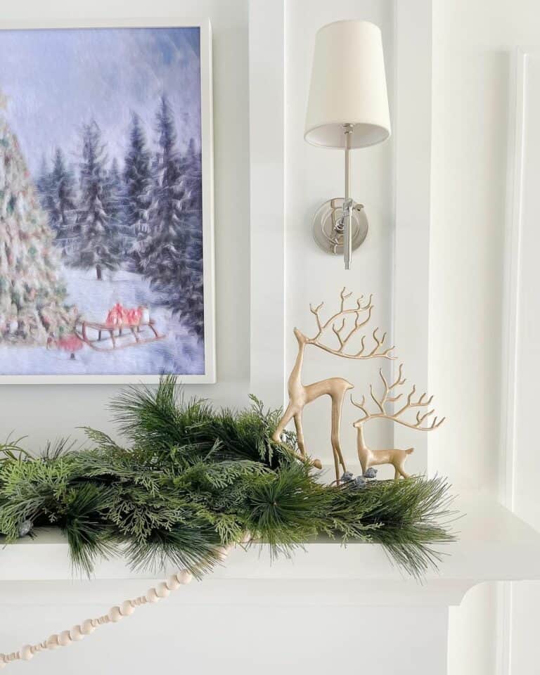 White Fireplace Mantel With Gold Christmas Deer Décor