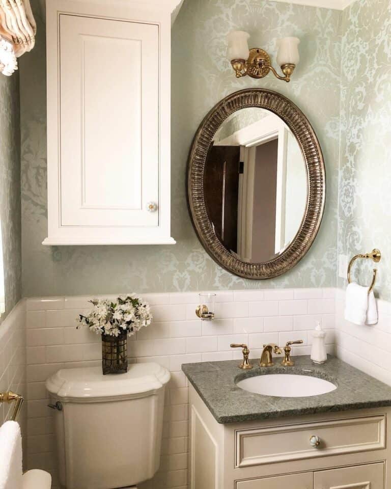 White Flowers and an Ornate Silver Mirror