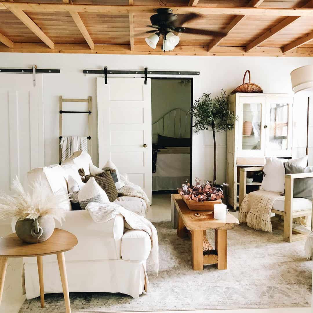 White Living Room With Wood Ceiling Panels - Soul & Lane