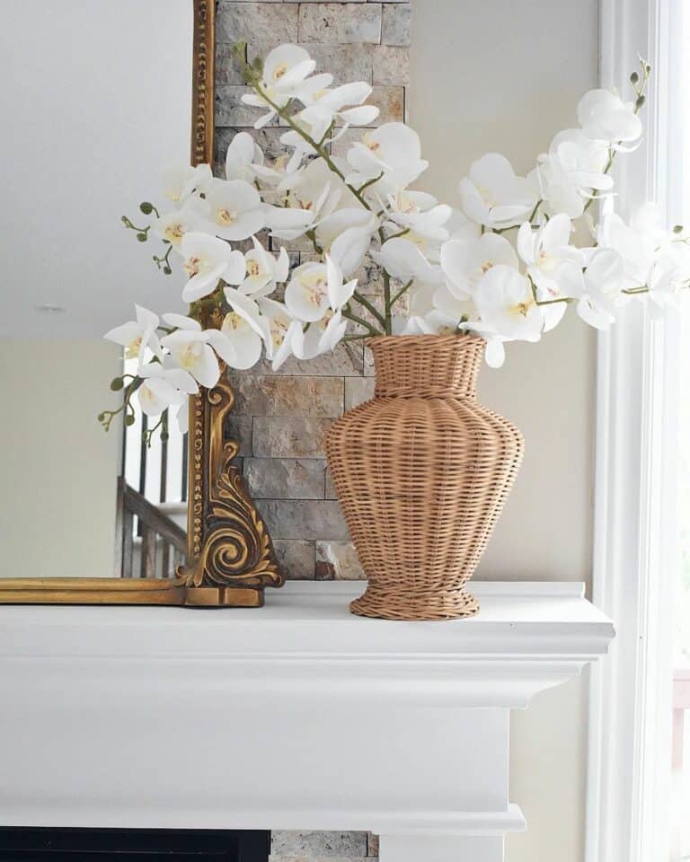 White Mantelpiece With White Flowers