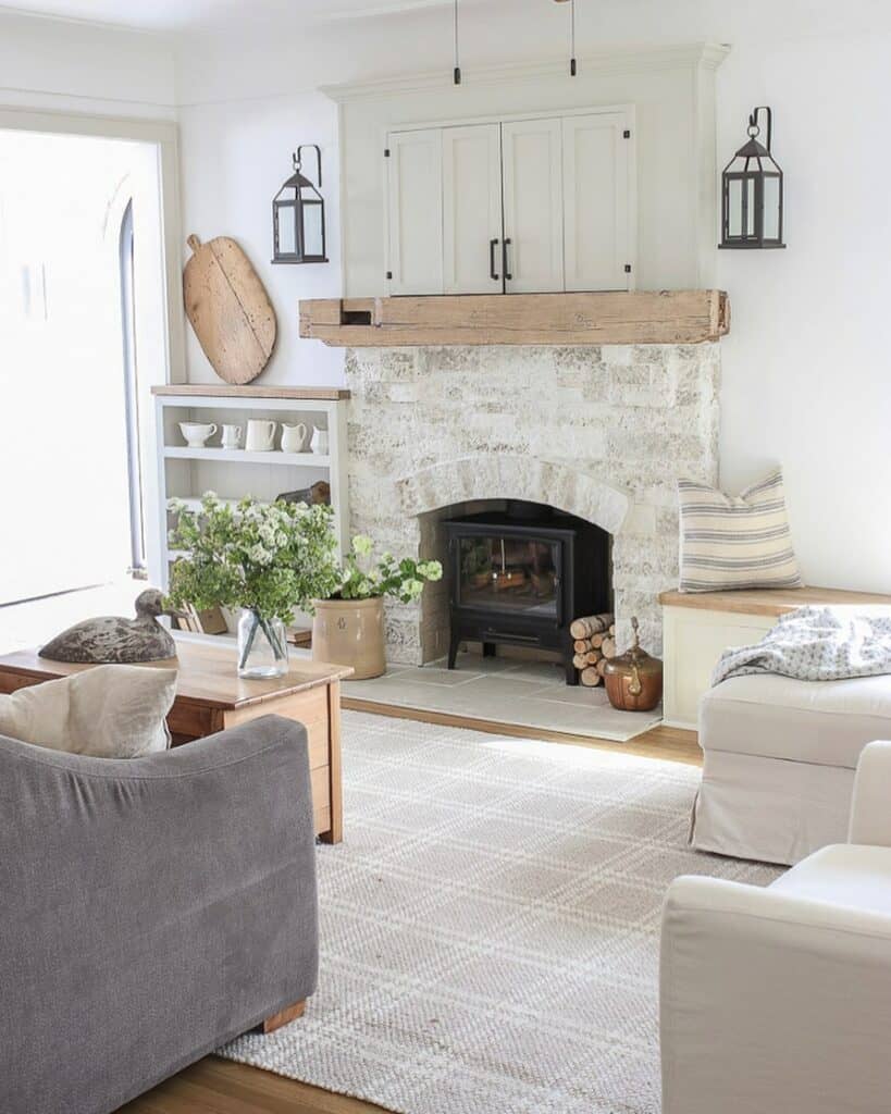 White Stone Fireplace With Wooden Mantel