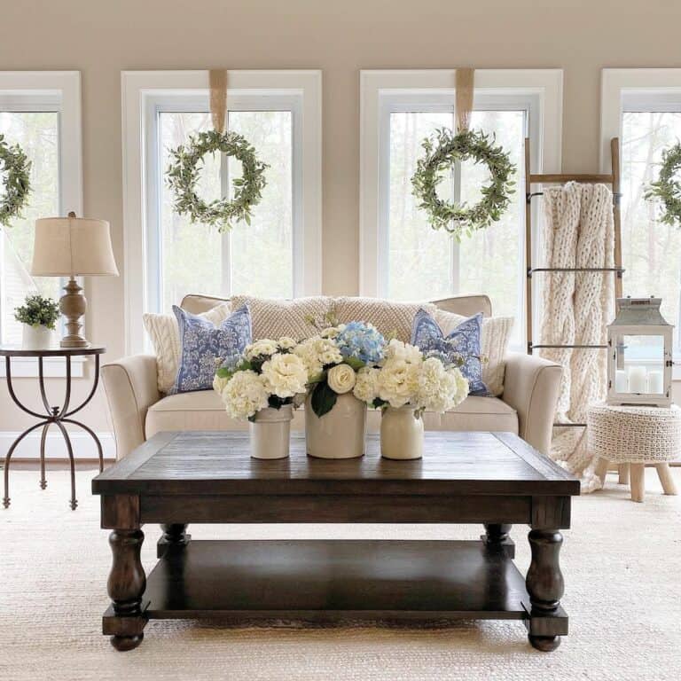 White and Blue Flowers in White Vases