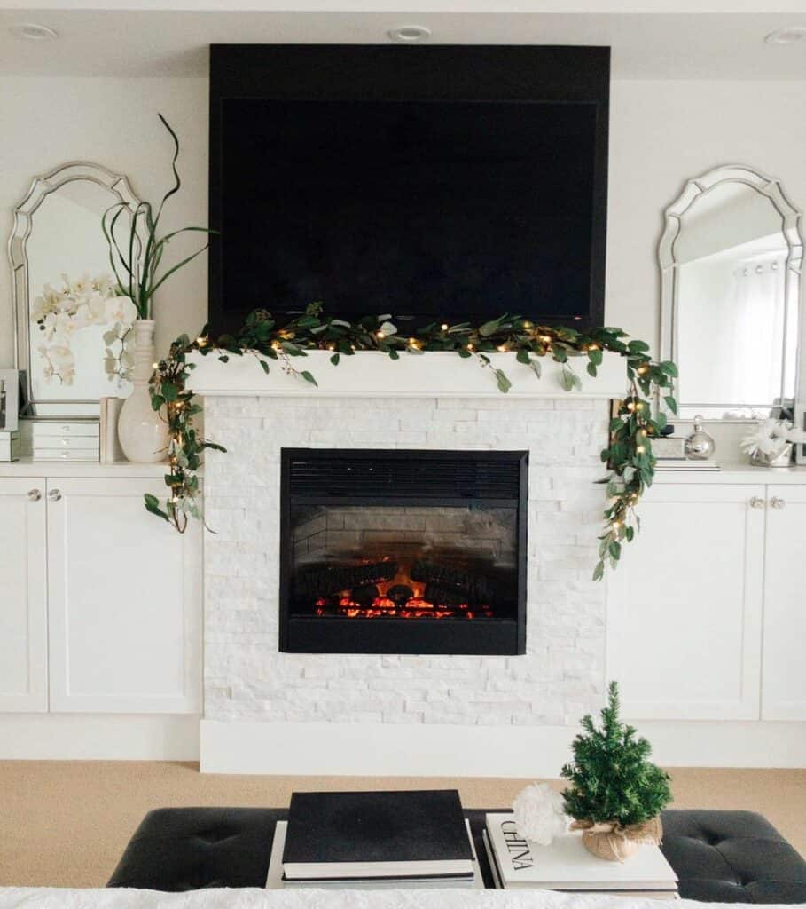 White-stone Fireplace Topped With Festive Décor