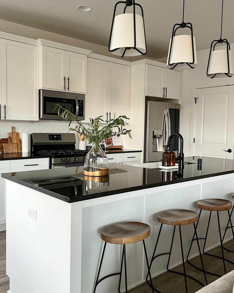 Wood Stools Beside Black and White Island