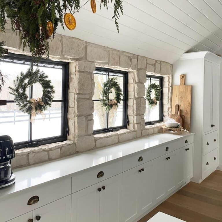 Wreaths on Windows in a Natural Stone Kitchen