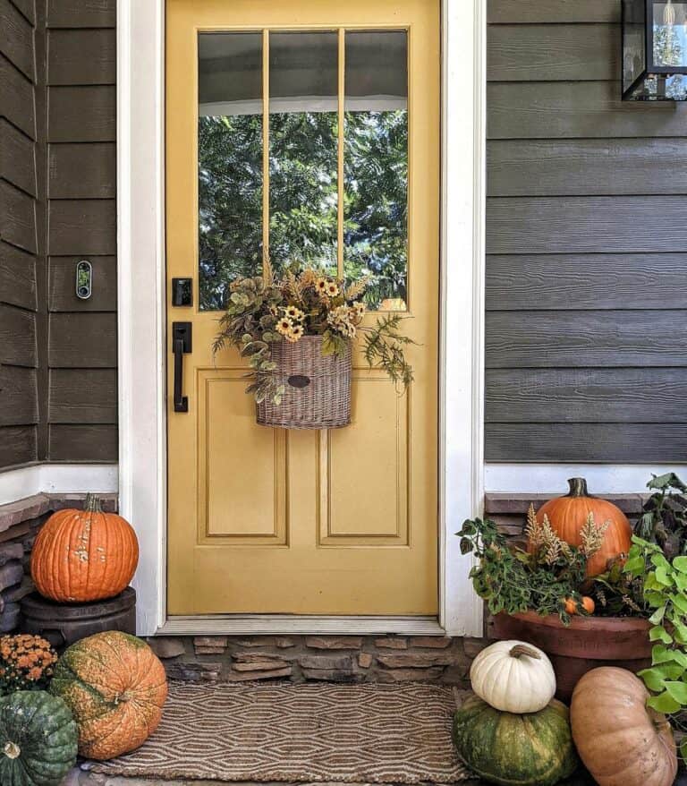 Yellow Door With Hanging Autumn Basket