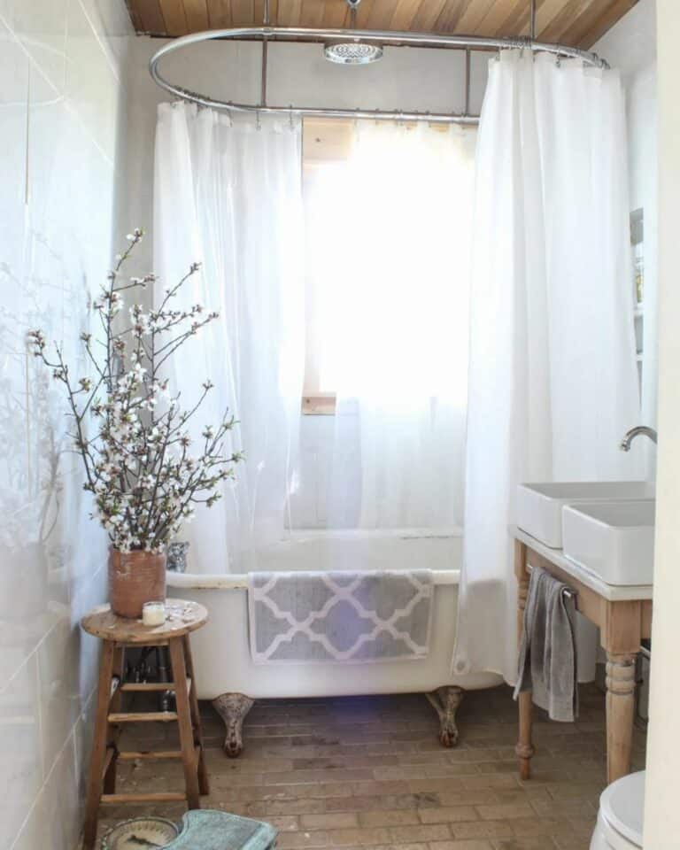 Airy Curtain Wrapped Around Clawfoot Bathtub