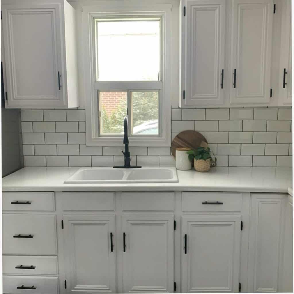 All-white Minimalist Kitchen With Subway Tile Backsplash