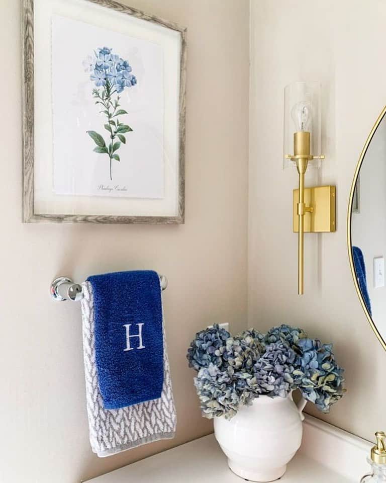 Bathroom With Blue Hydrangeas and Gold Accents