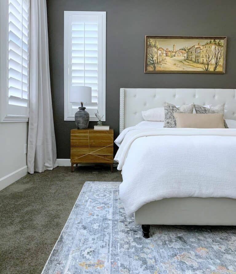 Beautiful Artwork Above White Tufted Headboard